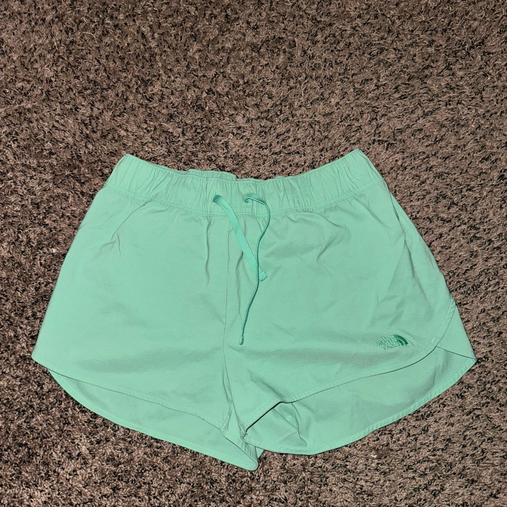 Green north face athletic shorts